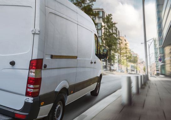 Delivery Van On City Street 1800X900